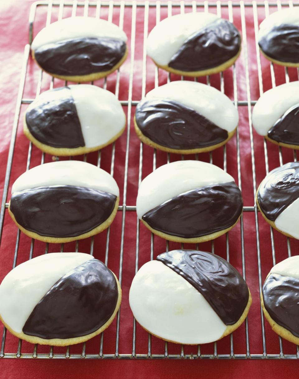 <p>These cake-like cookies, coated with a thick layer of frosting are practically a symbol for New York City. Whether you opt for rounds covered in fondant icing or frosting could cause a bit of debate among fans, but the two-tone appearance is non-negotiable.</p><p>Get the recipe from <a href="https://www.delish.com/cooking/recipe-ideas/recipes/a6617/black-white-cookies-recipe/" rel="nofollow noopener" target="_blank" data-ylk="slk:Delish;elm:context_link;itc:0;sec:content-canvas" class="link ">Delish</a>.</p>