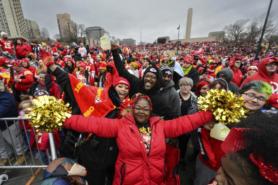 Fans celebrate during the Kansas City Chiefs' victory celebration and parade in Kansas City, Mo., Wednesday, Feb. 15, 2023. The Chiefs defeated the Philadelphia Eagles Sunday in the NFL Super Bowl 57 football game. (AP Photo/Reed Hoffman)