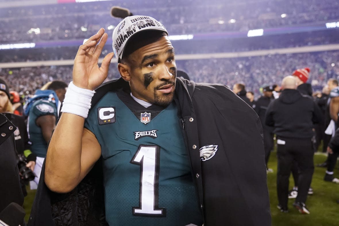 Philadelphia Eagles quarterback Jalen Hurts walks on the field after the NFC Championship NFL football game between the Philadelphia Eagles and the San Francisco 49ers on Sunday, Jan. 29, 2023, in Philadelphia. The Eagles won 31-7. (AP Photo/Seth Wenig)