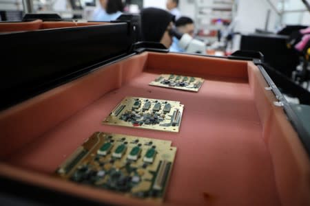 FILE PHOTO: Printed circuit boards are seen at the production facility of the automated test equipment designer and solutions provider Aemulus Holdings Berhad in Penang