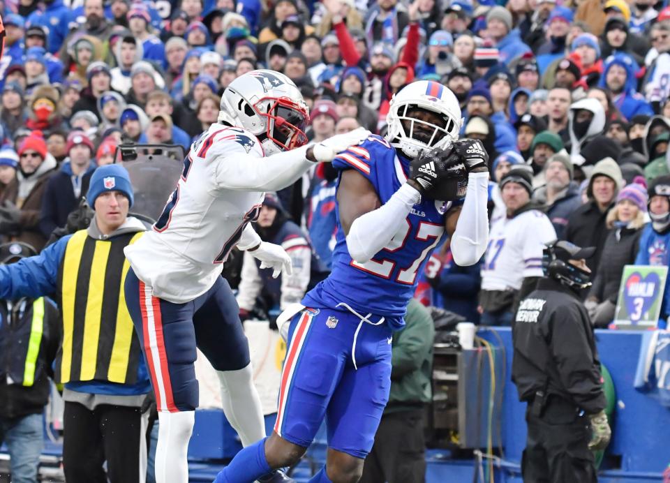 Jan 8, 2023; Orchard Park, New York, USA; Buffalo Bills cornerback Tre’Davious White (27) intercepts a pass intended for <a class="link " href="https://sports.yahoo.com/nfl/teams/new-england/" data-i13n="sec:content-canvas;subsec:anchor_text;elm:context_link" data-ylk="slk:New England Patriots;sec:content-canvas;subsec:anchor_text;elm:context_link;itc:0">New England Patriots</a> wide receiver <a class="link " href="https://sports.yahoo.com/nfl/players/28408/" data-i13n="sec:content-canvas;subsec:anchor_text;elm:context_link" data-ylk="slk:Nelson Agholor;sec:content-canvas;subsec:anchor_text;elm:context_link;itc:0">Nelson Agholor</a> (15) in the third quarter at Highmark Stadium. Mandatory Credit: Mark Konezny-USA TODAY Sports