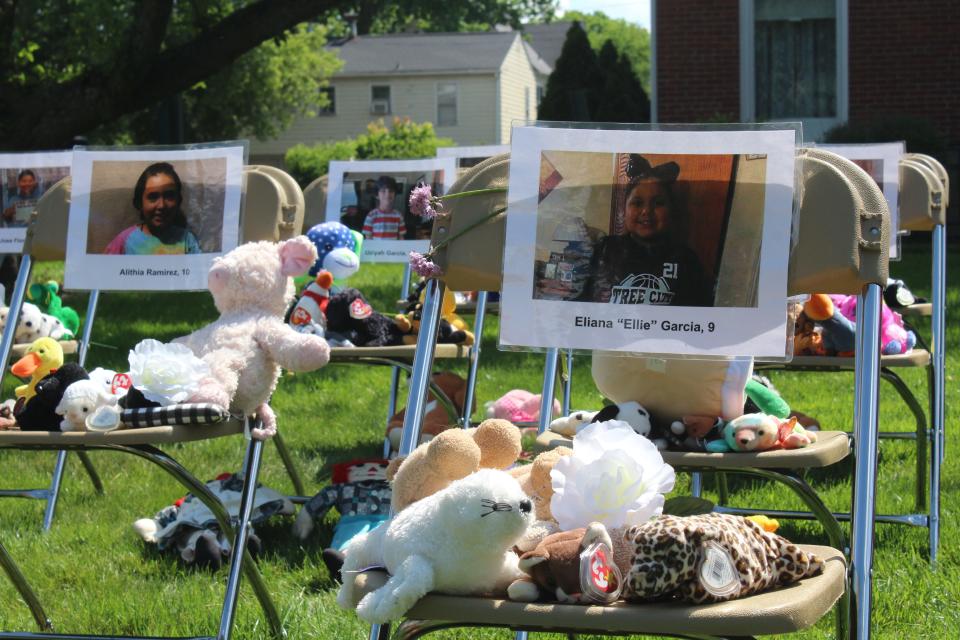 Wooster residents placed stuffed animals, flowers, battery-powered candles and pennies on the chairs at Central Christan Church that represent the 21 students and teachers who died in the Uvalde, Texas, school shooting last week.