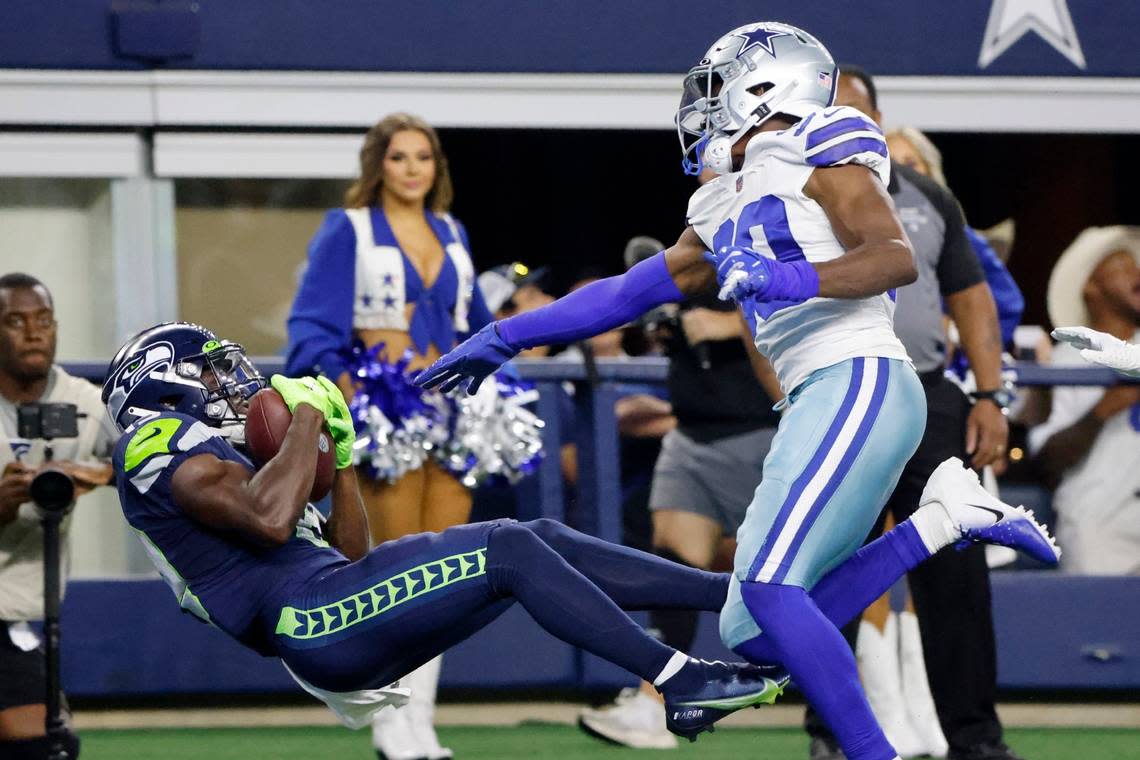 Seattle Seahawks wide receiver Penny Hart catches a touchdown pass as Dallas Cowboys cornerback DaRon Bland, right, defends in the first half of a preseason NFL football game in Arlington, Texas, Friday, Aug. 26, 2022. (AP Photo/Michael Ainsworth)