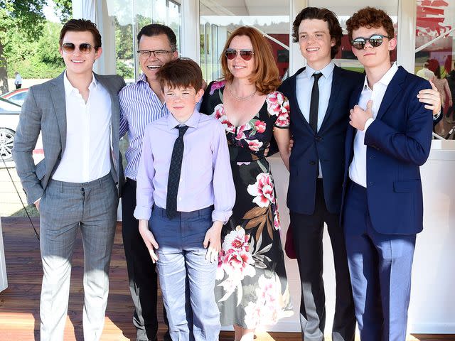 <p>David M. Benett/Dave Benett/Getty </p> Tom Holland poses with his family Dominic Holland, Paddy Holland, Nicola Holland, Sam Holland and Harry Holland at the Audi Polo Challenge at Coworth Park Polo Club on June 30, 2018 in Ascot, England.