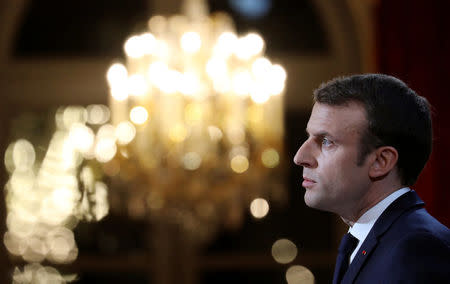 French President Emmanuel Macron delivers his New Year wishes to the members of the press corps at the Elysee Palace in Paris, France, January 3, 2018. REUTERS/Ludovic Marin/Pool