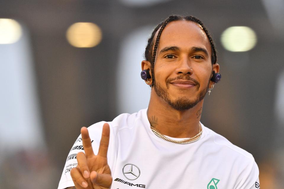 Mercedes' British driver Lewis Hamilton takes part in the drivers' parade before the start of the Formula One Singapore Grand Prix at the Marina Bay Street Circuit in Singapore on September 22, 2019. (Photo by Mladen ANTONOV / AFP)        (Photo credit should read MLADEN ANTONOV/AFP/Getty Images)