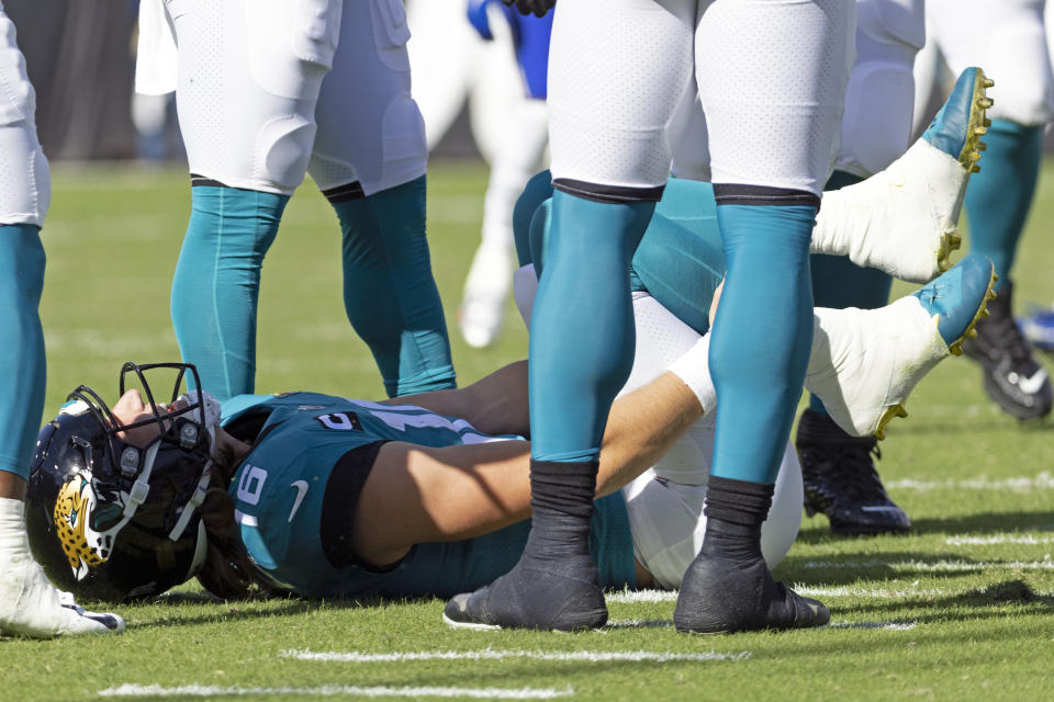 Jacksonville Jaguars quarterback Trevor Lawrence lies on the field after he was injured in a play during the first half of an NFL football game against the Buffalo Bills, Sunday, Nov. 7, 2021, in Jacksonville, Fla. (AP Photo/Stephen B. Morton)