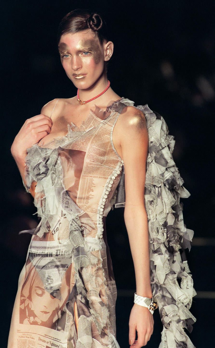 a model presents a christian dior daily newspaper inspired dress by john galliano for christian dior during the autumn winter 20002001 ready to wear collections in paris 29 february 2000 photo credit should read pierre verdyafp via getty images