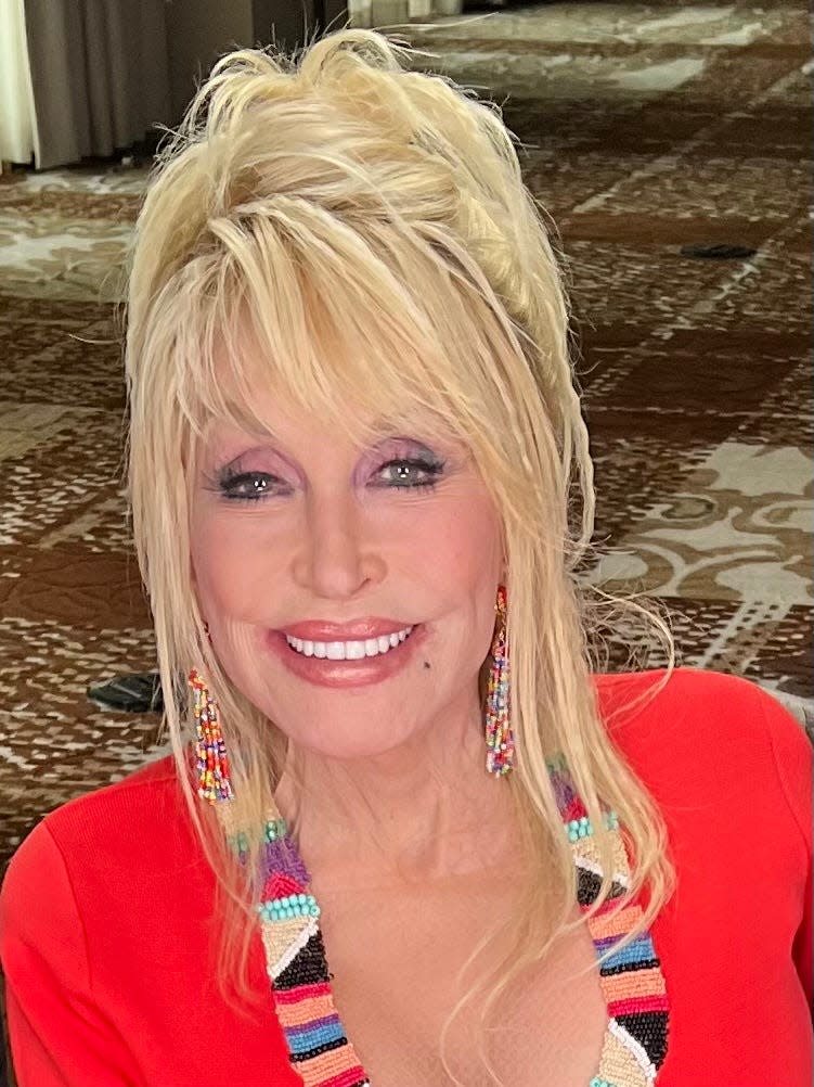 Dolly Parton's bright smile lights up even further when talking about her community.