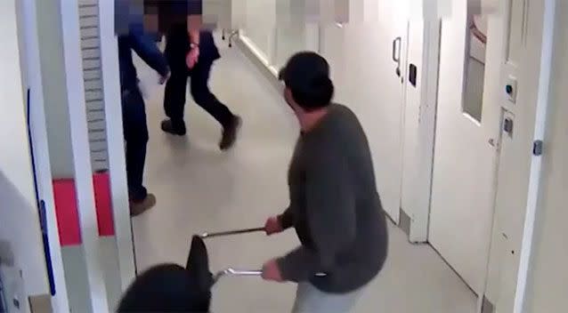 A man uses a chair against staff. Source: Royal Melbourne Hospital