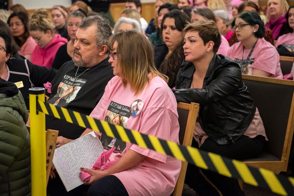 ikki Kuhnhausen's stepfather Vincent Woods, left, and mother Lisa Woods, right, listen to the judge during the bail review hearing for David Y. Bogdanov at Clark County Superior Court on Thursday morning, Jan. 2, 2020. Judge David Gregerson set $750,000 bail Thursday for Bogdanov, the suspect in the slaying of a transgender Vancouver teen Nikki Kuhnhausen.