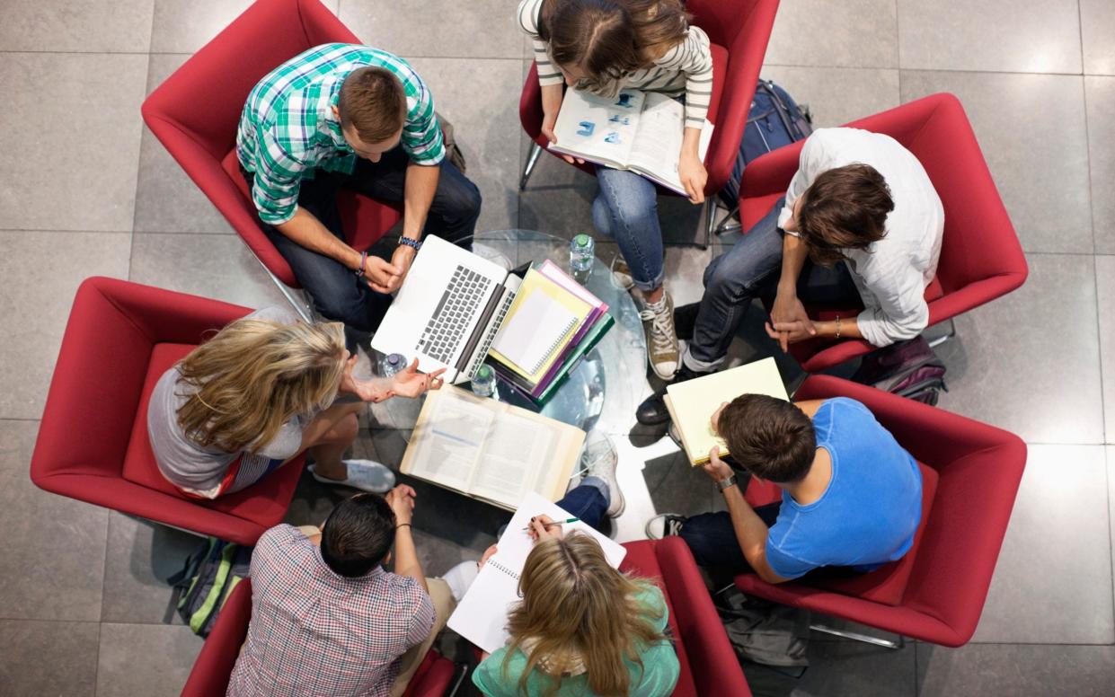 University students studying in a circle