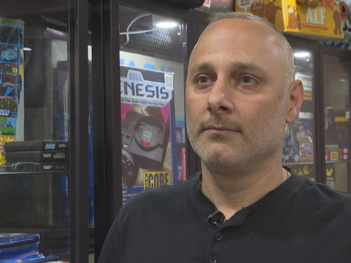 Johncarlo Salvatore of Oldcastle has about 45 vintage game consoles.  (Tyler Clapp/CBC - image credit)