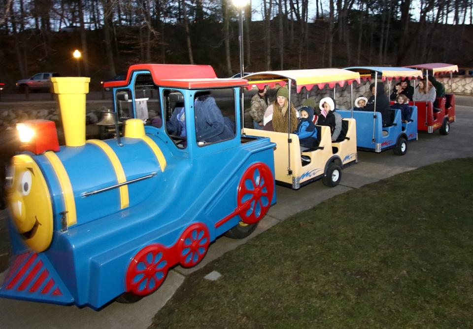 "The Magical Train" carried children and parents on a loop around the pond during the 2021 Christmas in the Park event Saturday, Dec. 4, 2021, at Silver Park in Alliance.