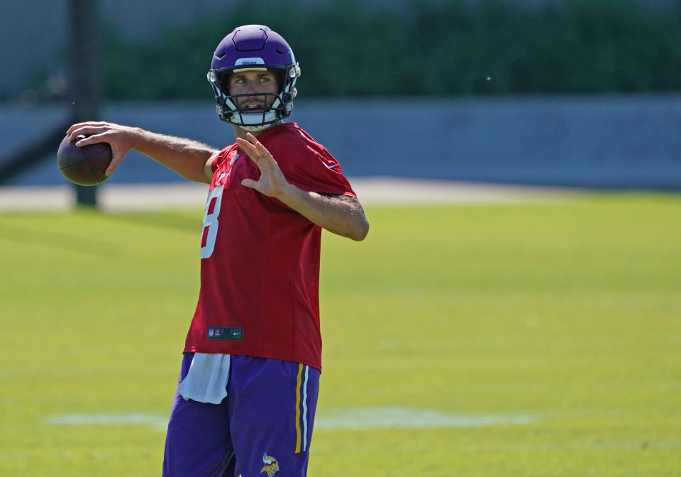 Kirk Cousins throws pass at practice.