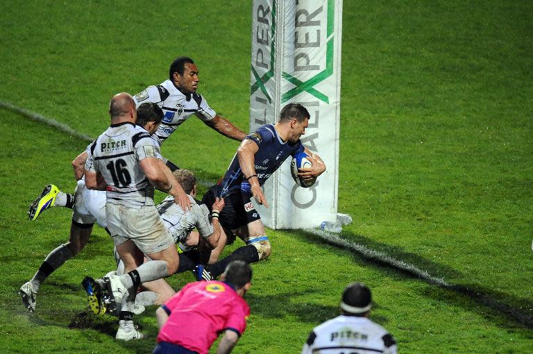 Castres winger Remy Grosso scores a try during a top 14 rugby match against Brive in the Pierre-Antoine stadium in Castres, on March 22, 2014
