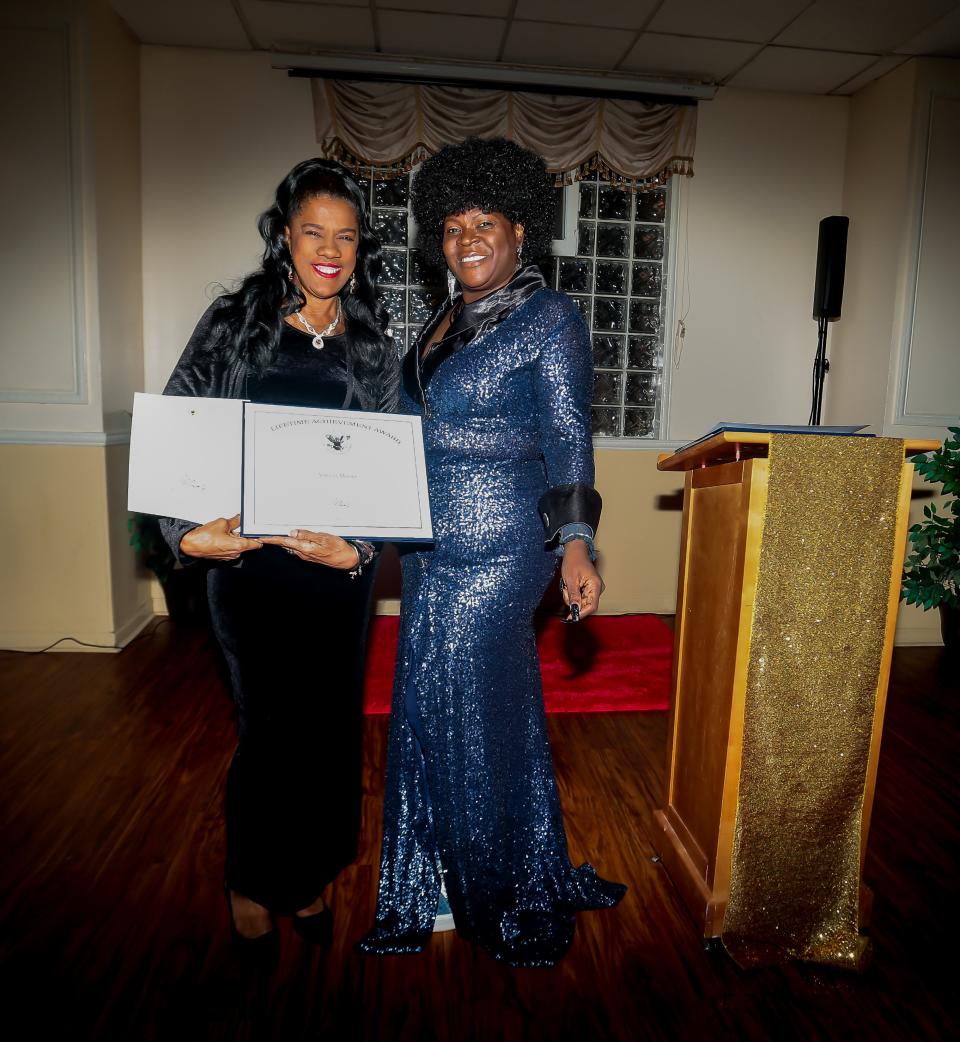 Amelia Moore, recipient of the President's Lifetime Achievement Award, shares the honor with Dr. Reba Renee Perry-Ufele of Diva Dtynasty Magazine.