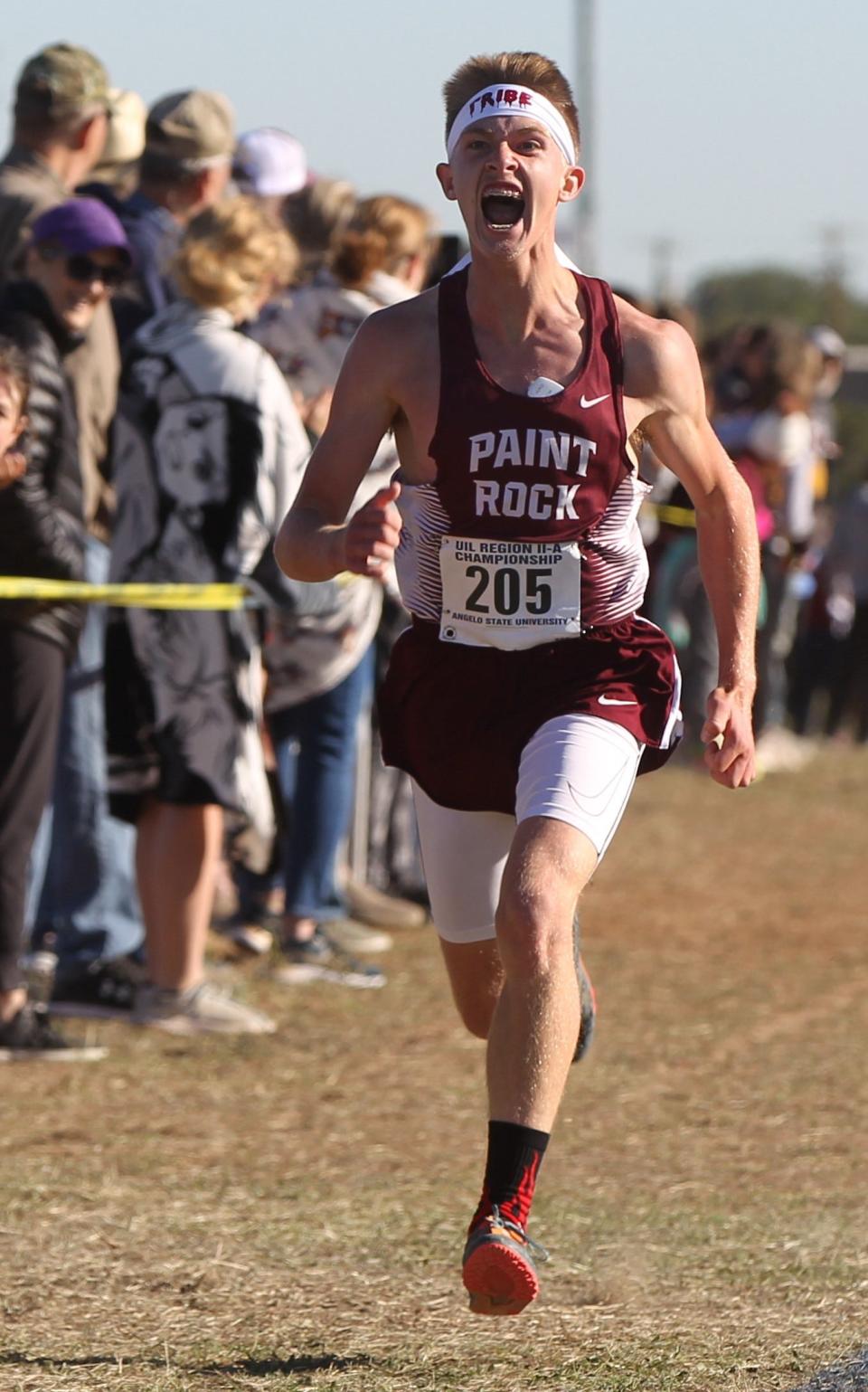 Paint Rock High School's Austin Magness announces his presence near the finish line in finishing runner-up in the boys division at the Region II-1A Cross Country Championships Tuesday, Oct. 25, 2022, at the Angelo State University Intramural Fields.