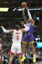 Utah Jazz guard Keyonte George (3) shoots as Houston Rockets forward Dillon Brooks (9) defends during the first half of an NBA basketball game Thursday, April 11, 2024, in Salt Lake City. (AP Photo/Rick Bowmer)