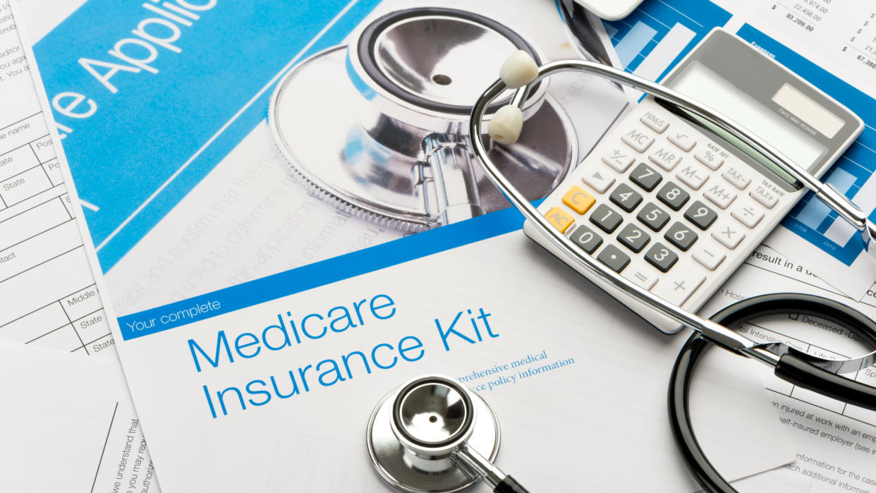 Medicare brochure with paperwork.