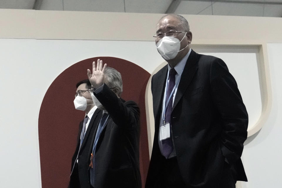 Xie Zhenhua, right, China's special envoy for climate, walks through the COP27 U.N. Climate Summit, Friday, Nov. 18, 2022, in Sharm el-Sheikh, Egypt. (AP Photo/Nariman El-Mofty)