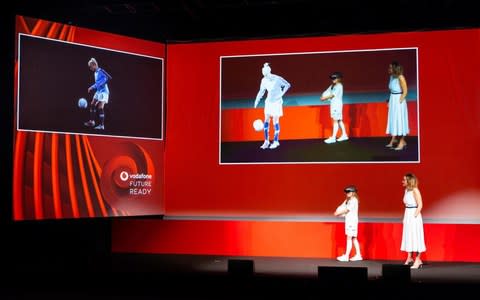 Steph shared the stage with 11-year-old Lionesses super fan Iris, who was there in person. The footballer’s hologram talked to Iris and then showed her some footballing tips, including kick-ups.  - Credit: VODAFONE