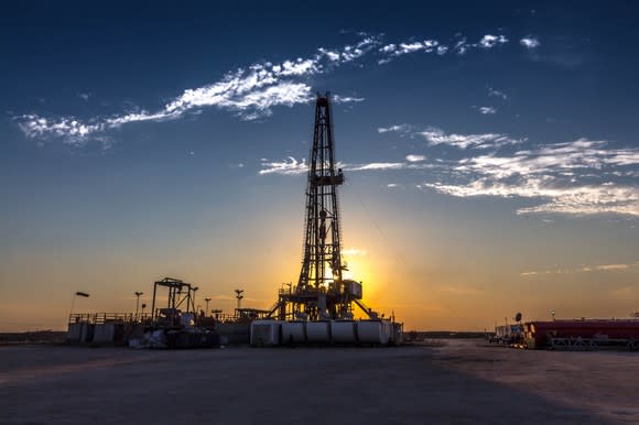 Land drilling rig at sunset.