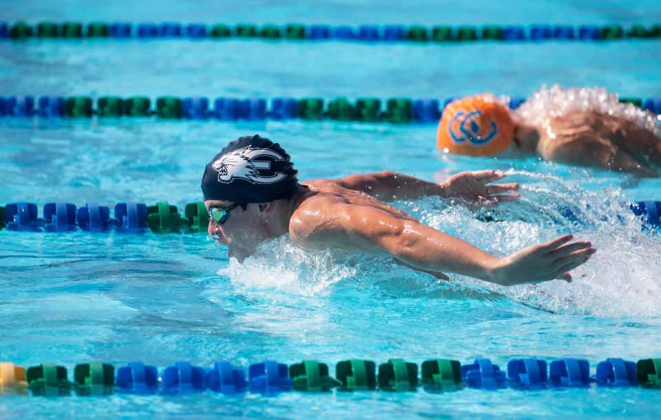 Nicholas Kirby of Estero leads Cole Wilson of Cape Coral in the 100 Yard Butterfly at the LCAC Championships on Friday, Oct. 6, 2023, at the FGCU Aquatic Center. Kirby won with a time of 55:02.