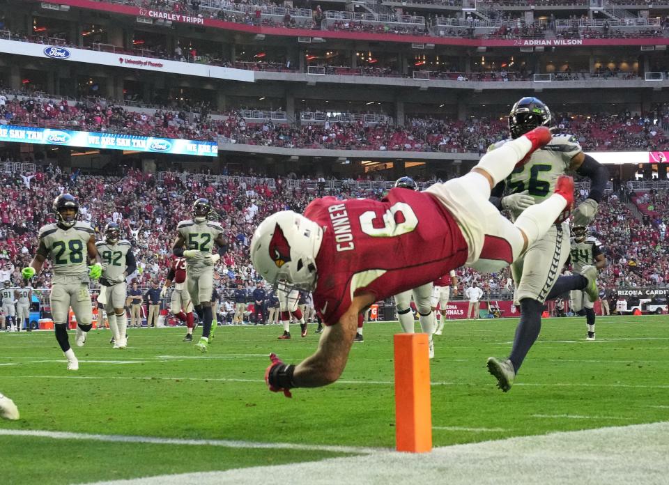 Jan 5, 2022; Glendale, Arizona, USA; Arizona Cardinals running back James Conner (6) scores a touchdown after a catch against the Seattle Seahawks during the third quarter. Mandatory Credit: Michael Chow-Arizona Republic