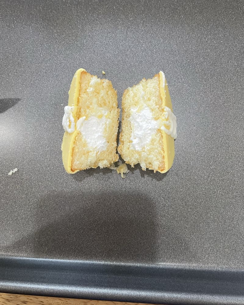 Lemon Cupcake Hostess snack cut open on baking sheet