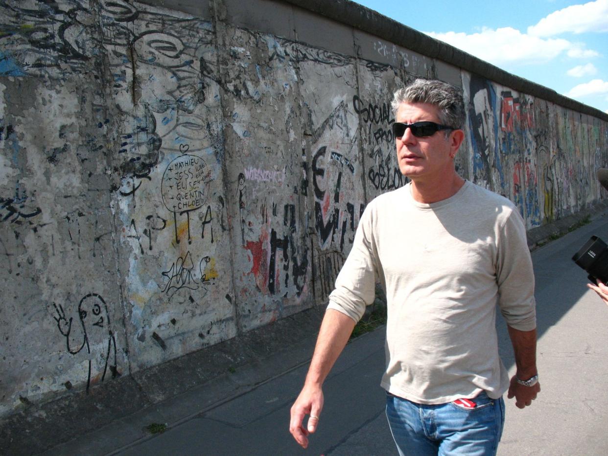 On top of his career as a chef and an author, Bourdain, here walking along the Gaza Strip in 2005, hosted the popular travel food shows "No Reservations" and "Parts Unknown" from 2005-2012, and then from 2013 to the present day.
