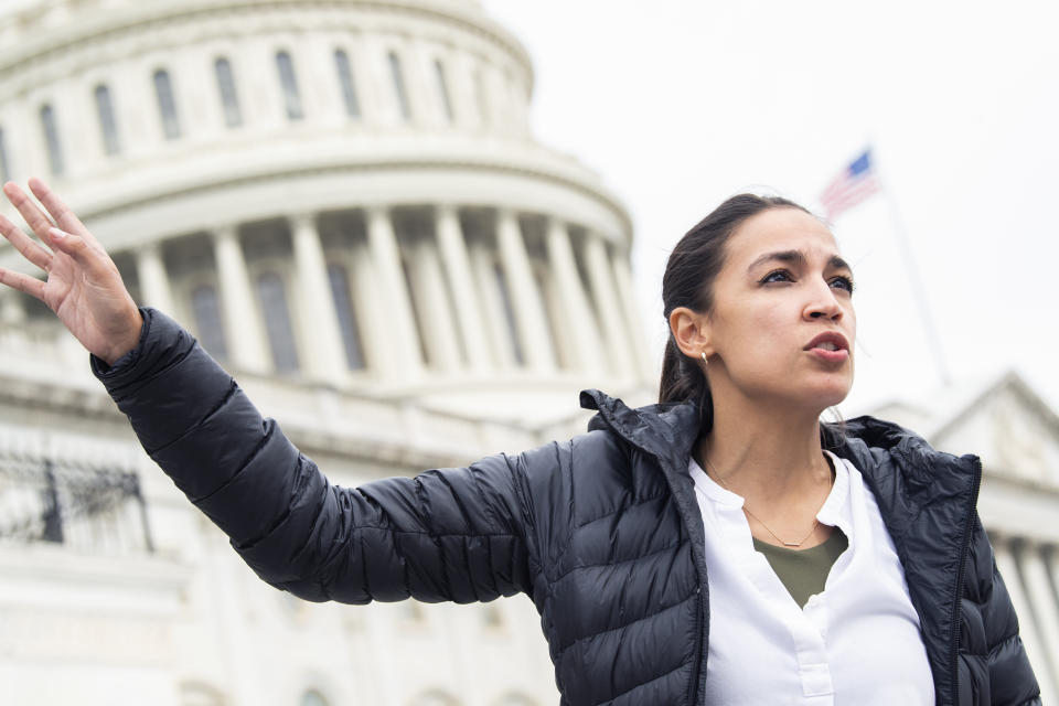 UNITED STATES - AUGUST 03: Rep. Alexandria Ocasio-Cortez, D-N.Y., is seen on the House steps of the Capitol during a vigil lead by Rep. Cori Bush, D-Mo., to call on President Biden and Congress to renew the expiring eviction moratorium on August 03, 2021. (Photo By Tom Williams/CQ-Roll Call, Inc via Getty Images)