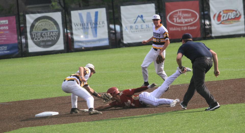 Watkins Memorial's Ethan Ryan tags out Bishop Watterson's Ryan Mulligan, who was attempting to steal, on Tuesday.