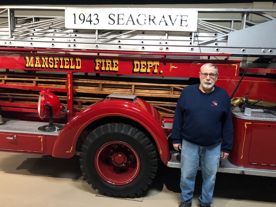 Marvin Gallaway stands in front of a 1943 Seagrave fire truck on display at the Mansfield Fire Museum. A retired firefighter, Gallaway has been co-director of the museum since 2005.