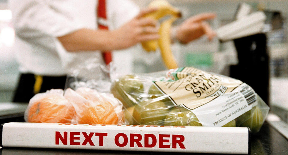 A Woolworths supermarket checkout with 'next order' sign on 24 August 2004. 