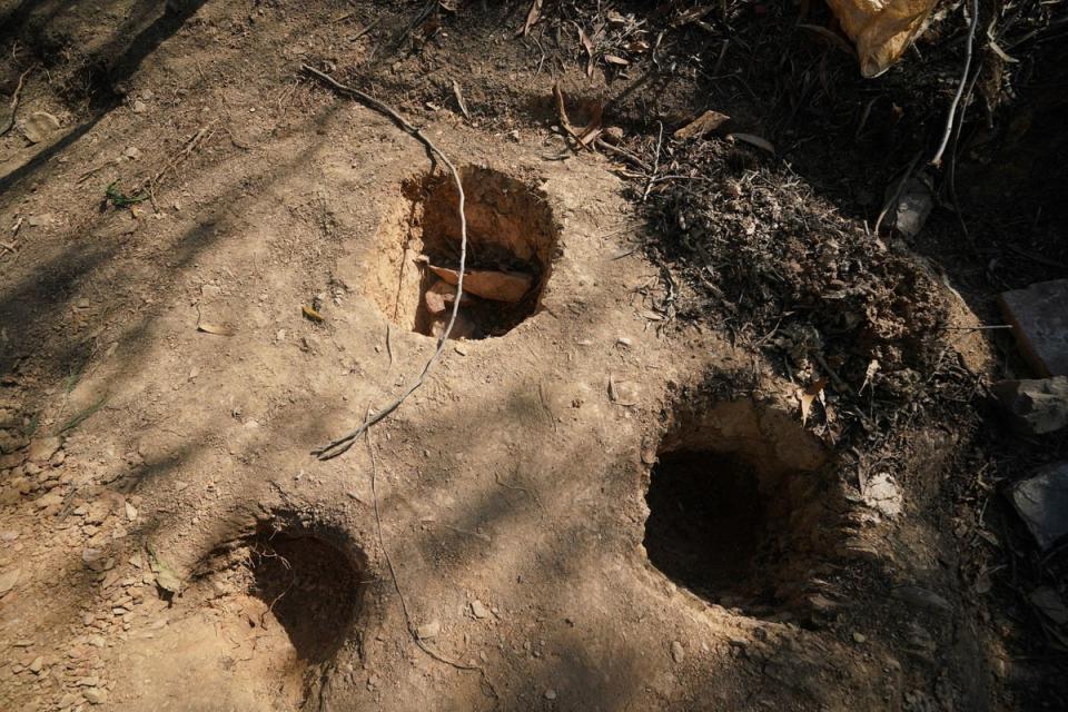 Holes dug apparently for soil samples in the area around Barragem do Arade reservoir (PA)