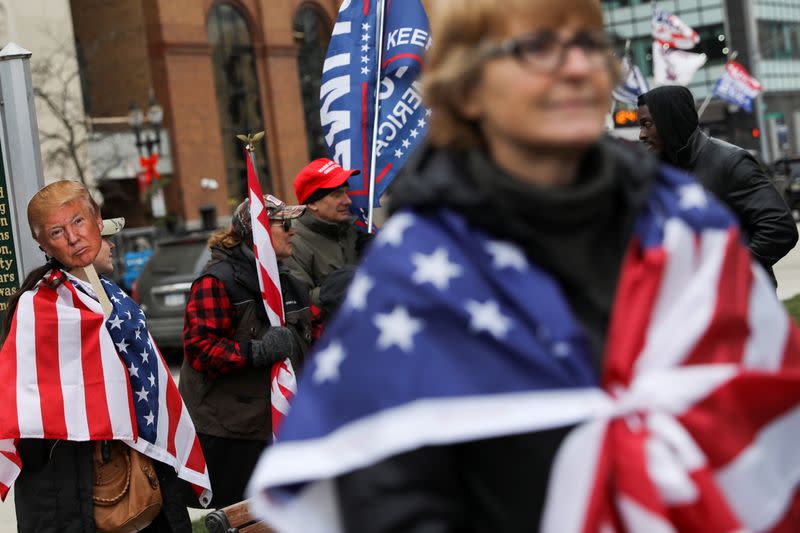 People take part in an event to show their support for U.S. President Donald Trump in Lansing