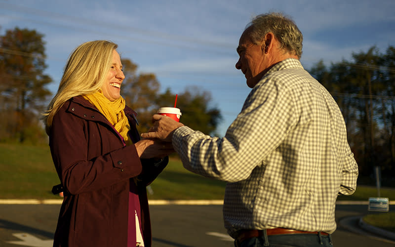 Rep. Abigail Spanberger (D-Va.) receives coffee from Sen. Tim Kaine (D-Va.)