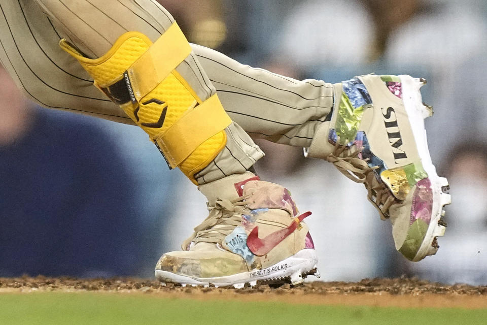 FILE - San Diego Padres' Fernando Tatis Jr.'s cleats are seen as Tatis grounds out during the 10th inning of a baseball game against the Los Angeles Dodgers on April 12, 2024, in Los Angeles. Tatis Jr. plans to unveil 50 pairs of custom cleats this season.(AP Photo/Mark J. Terrill, File)