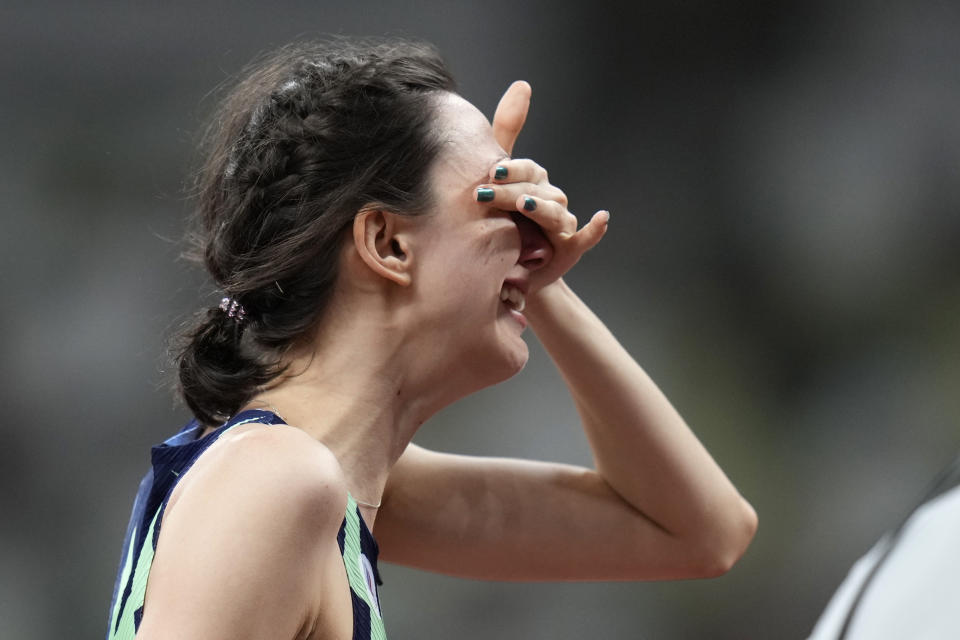 Mariya Lasitskene, of the Russian Olympic Committee, reacts after winning the women's high jump final at the 2020 Summer Olympics, Saturday, Aug. 7, 2021, in Tokyo. (AP Photo/Petr David Josek)