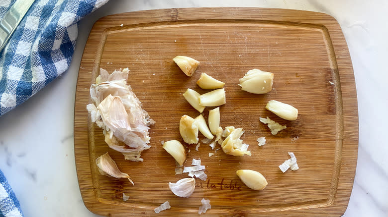 roasted garlic cloves on cutting board