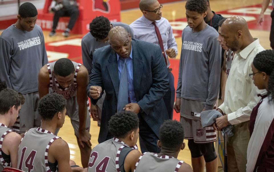 Al Gooden, Head Coach of Lawrence North, talks strategy with his players during the 2019 Marion County boys basketball tournament, Southport High School, Southport, Friday, Jan. 11, 2019. Lawrence Central beat Southport 66-31. 