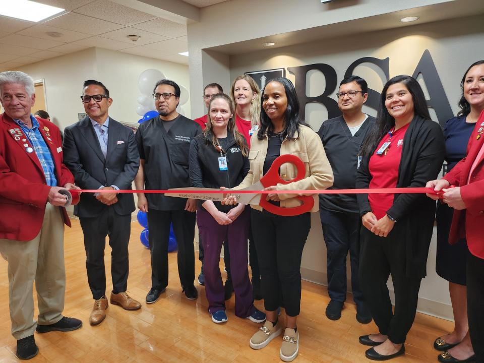 BSA and the Amarillo Chamber of Commerce celebrate the grand opening of BSA's new Center for Advanced Therapeutic Endoscopy, as Glenda Harris, Assistant Chief Nursing officer at BSA, cuts the ceremonial ribbon during their Thursday afternoon ribbon cutting.