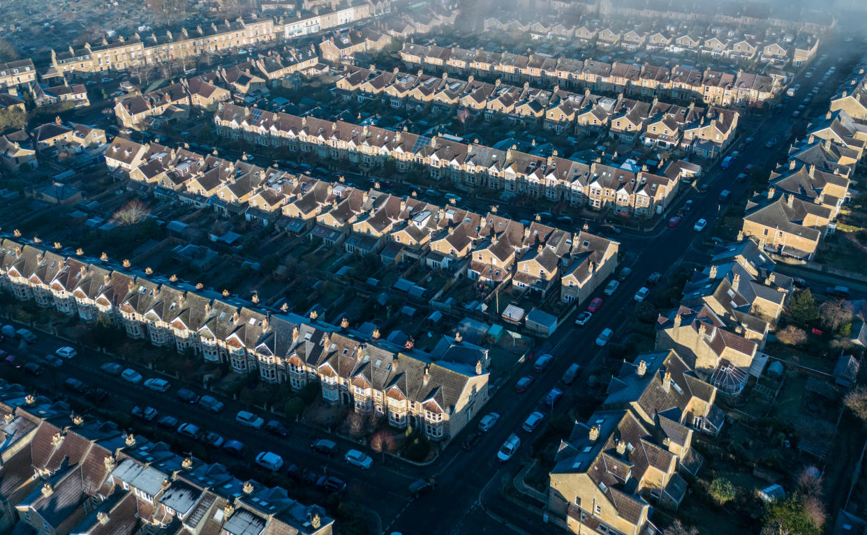 BATH, UNITED KINGDOM - FEBRUARY 05: Aerial view of early morning mist lingers above streets of residential houses that are seen from the air, on February 05, 2023 in Bath, England. According to a report from the Royal Institution of Chartered Surveyors (RICS) soaring interest rates and falling prices will mark the end of the UK’s 13-year housing market boom potentially leading to a house price crash. Adding to these woes is the fact that the UK is also currently facing a cost of living crisis, as inflation hits a near-30-year high, the war in Ukraine puts pressure on food prices and rising energy bills squeeze household incomes still further. (Photo by Matt Cardy/Getty Images)