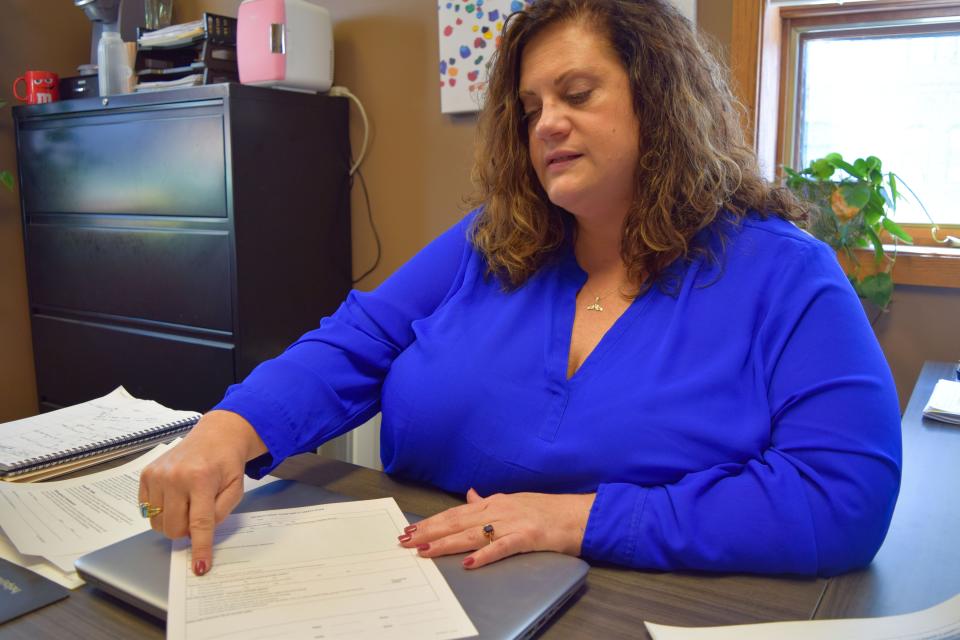 Kim Hansen, Southeastern Behavioral's Director of Operations, explains intake forms the 12-counselor mobile crisis team uses once they get on site with a person experiencing a mental health crisis on Friday, March 11th, 2022.