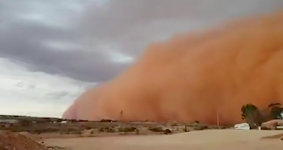 The gargantuan dust cloud creeps over White Cliffs in NSW’s northwest. Source: Facebook/ Bradley Atkins