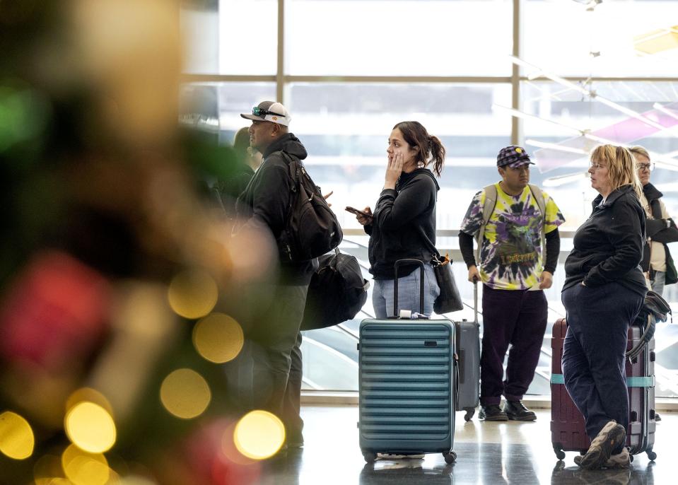 People wait in line at the Salt Lake City International Airport on Wednesday, Nov. 21, 2023. AAA estimates that 55.4 million travelers will head 50 miles or more from home over the Thanksgiving holiday period between Wednesday and Sunday, Nov. 26. | Laura Seitz, Deseret News