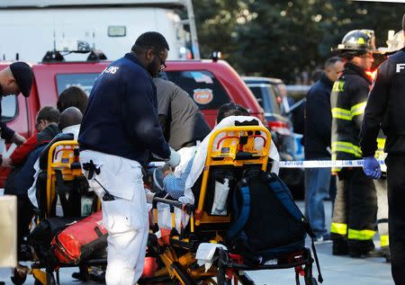 First responders tend to a victim after a shooting incident in New York City, U.S. October 31, 2017.