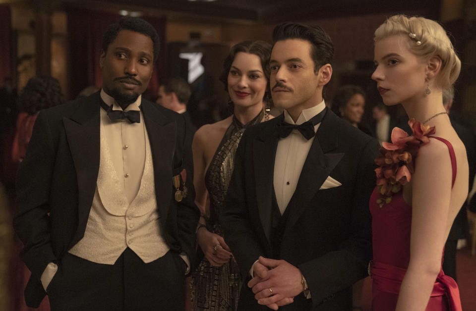 This image released by 20th Century Studios shows, from left, John David Washington, Margot Robbie, Rami Malek and Anya Taylor-Joy in a scene from "Amsterdam." (Merie Weismiller Wallace/20th Century Studios via AP)