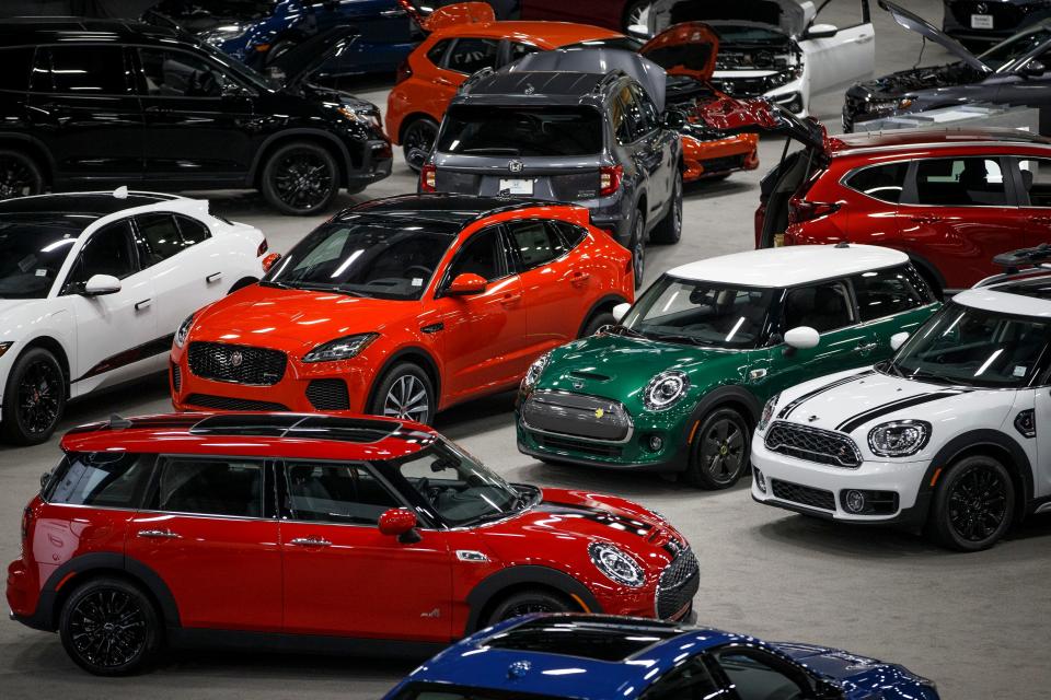 Cars load into Hy-Vee Hall for the All Iowa Auto Show on Wednesday, March 11, 2020, in Des Moines.